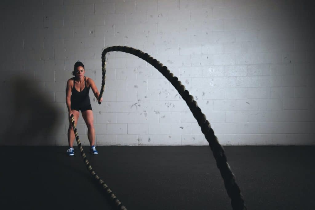 woman holding exercise ropes